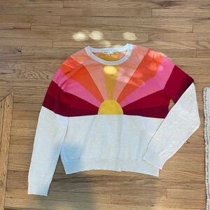 This is a beautiful sweater with a sunset design